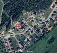 Aerial view of properties - housing in Pružina surrounded by green areas and forest.