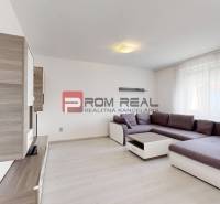 Living room with a sofa and cabinets in a 4-room apartment.
