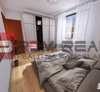 Bedroom in a 2-room apartment with a bed, built-in wardrobe, and a picture on the wall.