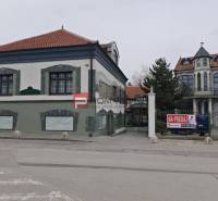 A building on Ľ. Podjavorinská Street, marked for sale, with historical style architecture.