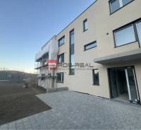 New apartment building in Pezinok on Pezinská Street with insulation work.