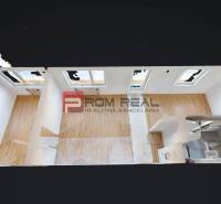 2-room apartment with wooden flooring, white walls, and a bathroom.
