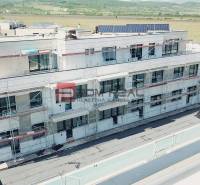 The building on Limbašská Road in Pezinok, which is under construction, with a view of the surroundings.