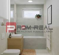 Bathroom in a 2-room apartment on Limbašská Street, modern tiles, bathtub, sink, toilet.
