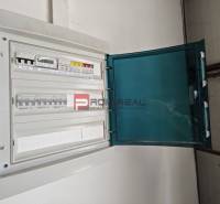 Electrical distribution cabinet in the warehouse and hall areas with an open cover.