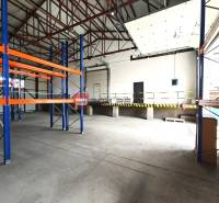 Warehouses and halls with shelves and a loading ramp.