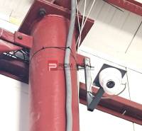 Security camera inside warehouses and halls, detail of a red metal pillar.