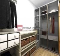 A wardrobe with shelves, drawers, and cabinets in a studio apartment.