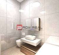 Bathroom with a washing machine, sink, toilet, and mirror in a studio apartment.