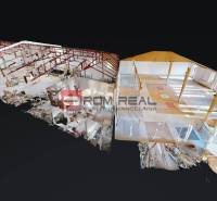The interior of the building with open spaces, red frame structures, and diverse flooring.