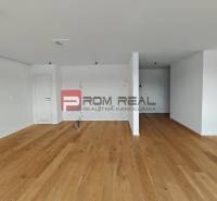 A spacious room with a wooden floor in a 4-room apartment, ready to be furnished.