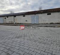 The exterior of an industrial building on Partizánska Street, warehouses and halls on the pavement.