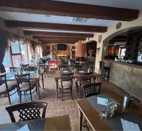 Restaurant in the hotel area with wooden beams, tables, and chairs. Hotels and guesthouses.