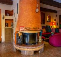 Interior with a fireplace, comfortable seating, and decorations in hotels and guesthouses.