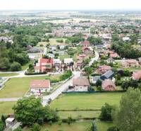 Aerial view of houses and greenery in the village of Marianka on Na Tálkoch street. Residential plots.
