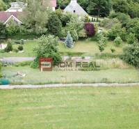 Aerial view of plots - housing on Na Tálkoch street in Marianka. Gardens and greenery.