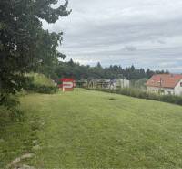 Building plot in Marianka on Na Tálkoch street with a view of the houses.
