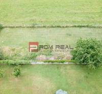Aerial view of properties - housing in Marianka, Na Tálkoch, with grassy area and trees.