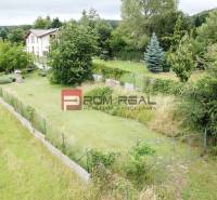 Plots - housing on Na Tálkoch Street in Marianka, surrounded by greenery and houses.