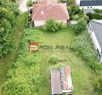 Aerial view of gardens and buildings on Na Tálkoch Street in Marianka, Residential plots.