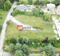 Lucrative residential plots on Štúrova Street in Marianka, surrounded by greenery and houses.