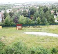 Plots - living with a view on Štúrova Street in Marianka surrounded by greenery and houses.