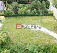 Plots - housing on Štúrova Street in Marianka, with greenery and family houses.