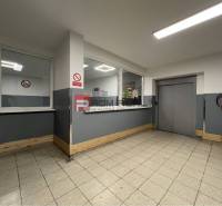 Interiors of warehouses and halls with fire protection equipment, windows, and an elevator.