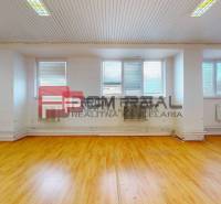 Warehouses and halls with wooden floors, white walls, and windows with blinds.