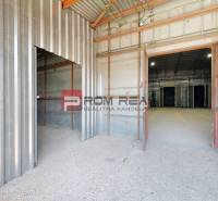 An interior view of industrial spaces, warehouses, and halls with metal walls and flooring.