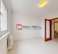 A bright room in a 4-room apartment with large windows and built-in lighting.