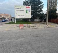 Parking space with office rental advertisement on Púchovská Street in Bratislava III.