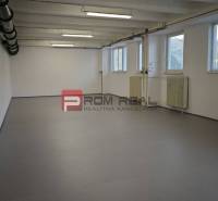 Interior of a warehouse with white walls, windows, and lights, Warehouses and halls.