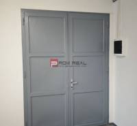 Gray double doors in the interior of warehouses and halls.