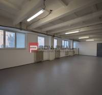 The interior of a warehouse and hall with white walls and floor.