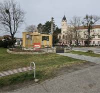Statue with a memorial, bench, and historic building in Ivanka pri Dunaji on Ivanka pri Dunaji street.