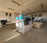 Production facilities with woodworking machines and materials ready for processing.