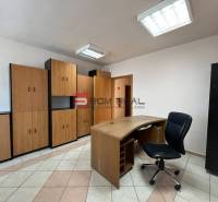 Office in production premises with furniture and a work desk.