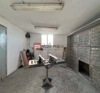 Production premises with a workbench, equipment, and lighting.