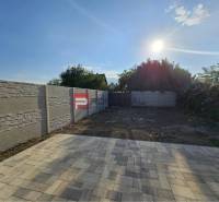 A flat reinforced area with paving and a fence on Ľadová Street in Miloslavov.