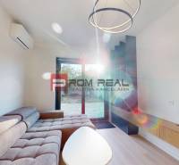 Living room in a family house with a sofa, table, and air conditioning.