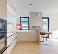 A kitchen in a family house with modern equipment and a bright interior.