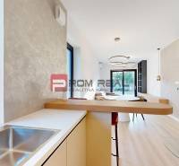 Interior of a family house with a kitchen, dining area, and fireplace, fresh colors and clean lines.