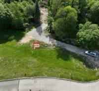 Plots - living on Na tálkoch street in Marianka surrounded by greenery and a car on the edge.