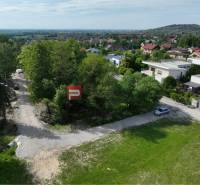 Plots - housing in Marianka on Na tálkoch street, surrounded by greenery and houses.