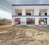 A family house in Dunajská Streda with a white facade and large windows.