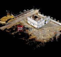 Unfinished family house in Dunajská Streda with adjacent land and road.