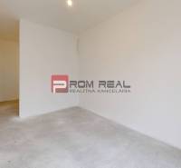 Empty room in a family house, white walls, floor without furniture.
