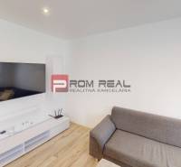 Living room with a TV and a sofa in a 3-room apartment.