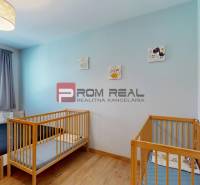 Children's room with a bed, cribs, and decorations in a 3-room apartment.